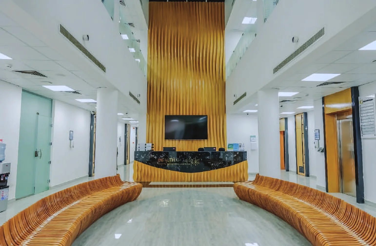 Health Gates — reception with sculpted timber seating