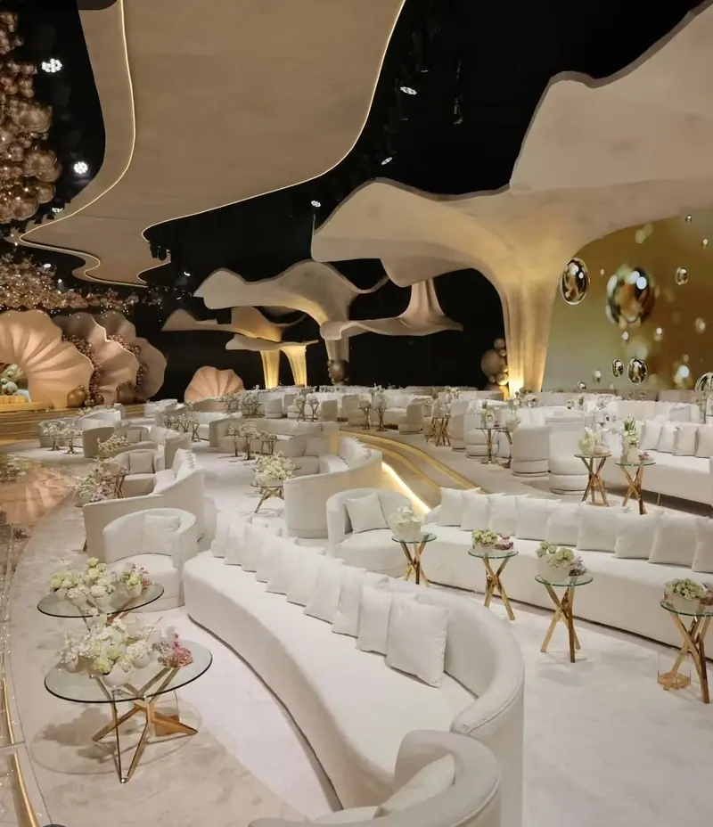 Lounge seating beneath the sculpted ceiling